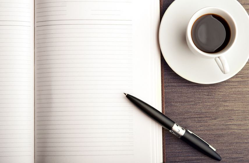 pen paper and coffee